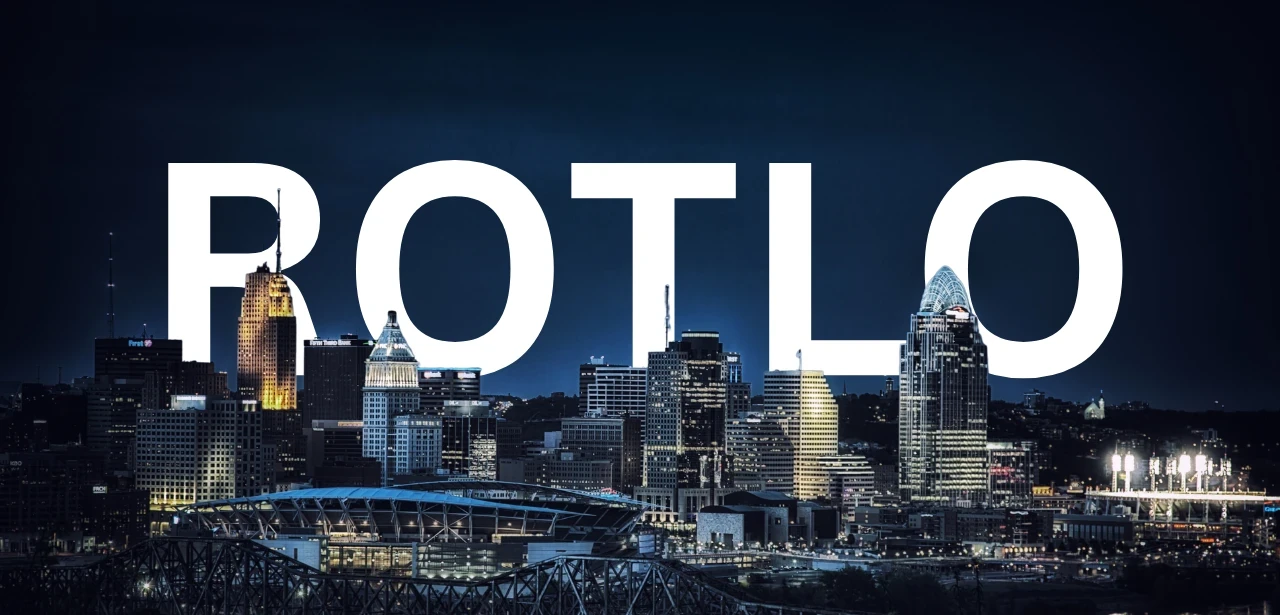 The Cincinnati skyline at night, with ROTLO standing behind the towers.